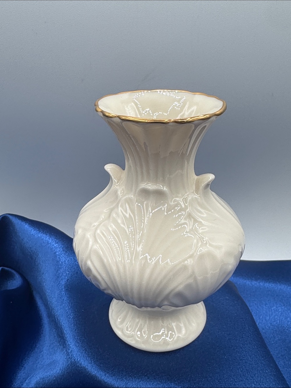 Lenox "Elfin" collection bud vase. Crafted in fine ivory porcelain.